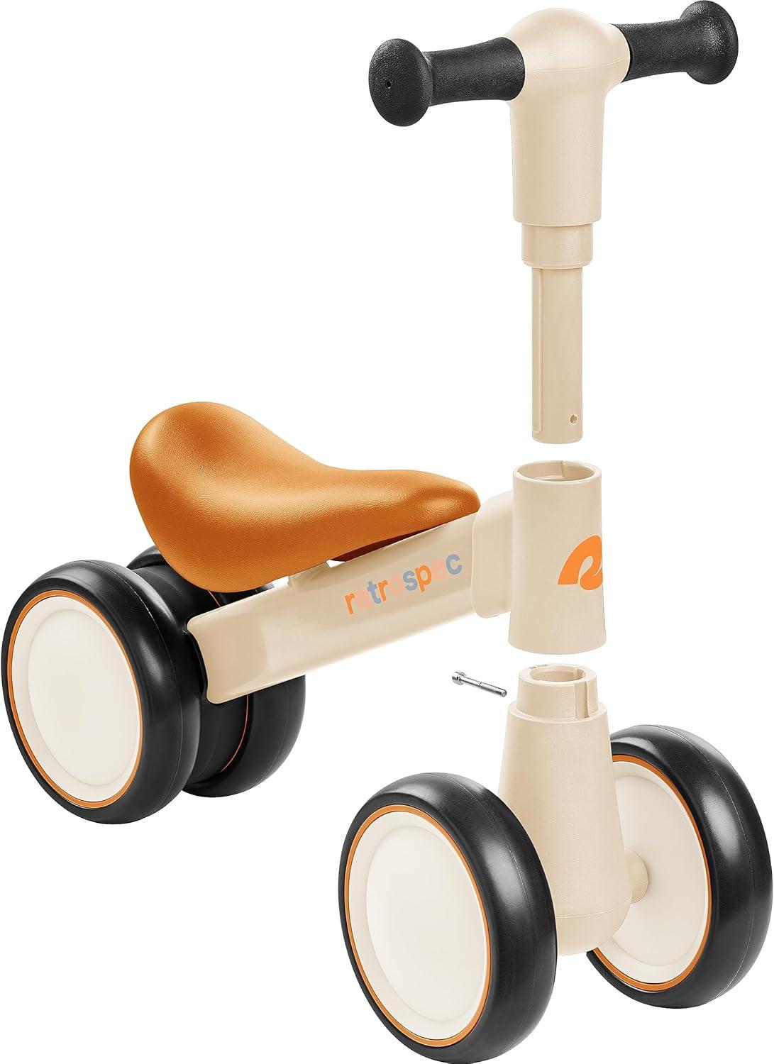 Retrospec Cricket 2 Baby Walker Balance Bike with 4 Wheels – Safe Learning Toy for Ages 12-24 Months – Scratch-Resistant Indoor Outdoor Toddler Riding Toy with Steering Limit & Soft Grips(Sandcastle)